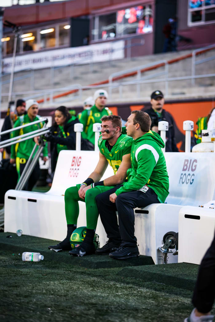 Quarterback Bo Nix sits with Kenny Dillingham following Saturday's game against Oregon State.